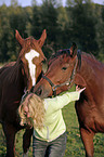 junge Frau mit Pferden