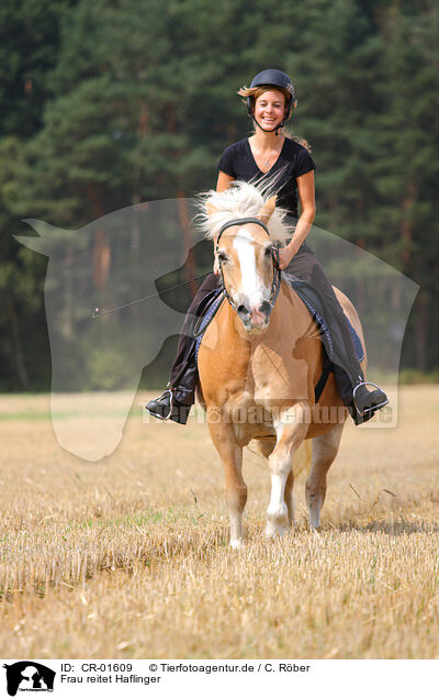 Frau reitet Haflinger / woman rides Haflinger horse / CR-01609